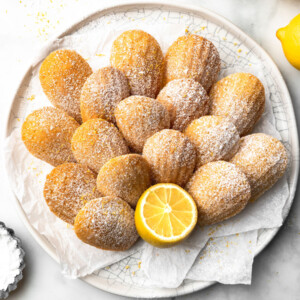 A white plate of lemon madeleines.