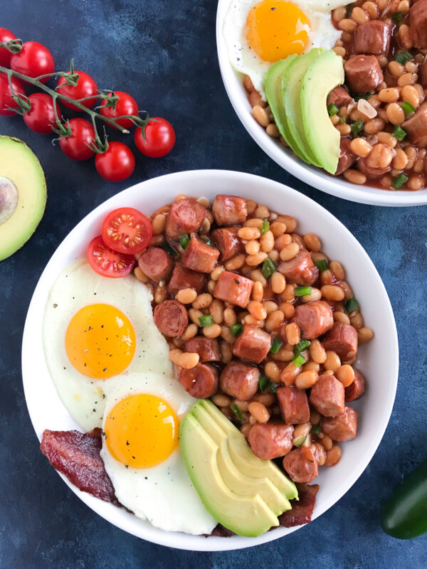 Baked Beans and Sausage in a white bowl.