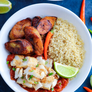 Caribbean Jerk Fish, quinoa, tomato sauce, and fried plantains topped with chilies