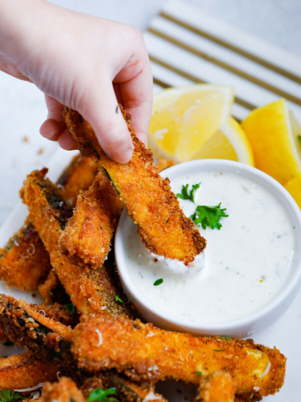 Spicy zucchini fries with parmesan cheese and chopped parsley