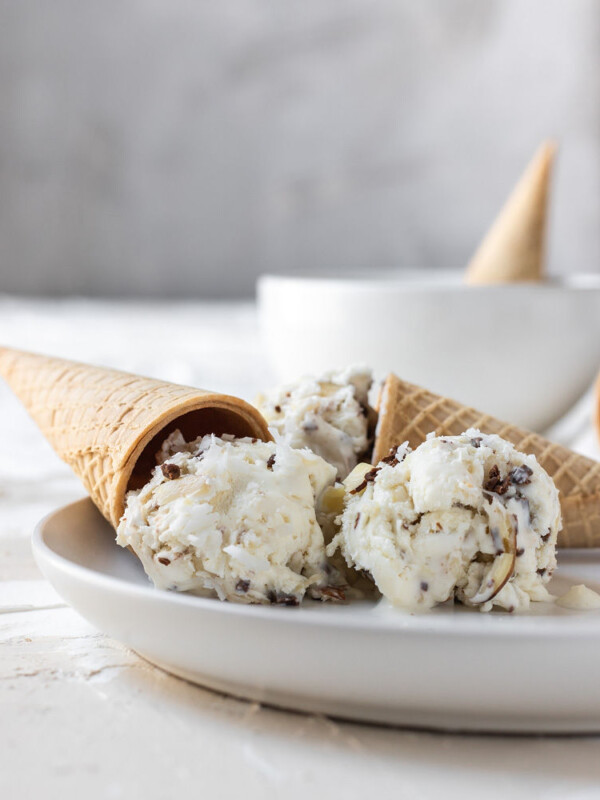 almond joy ice cream balls on a plate with a cone