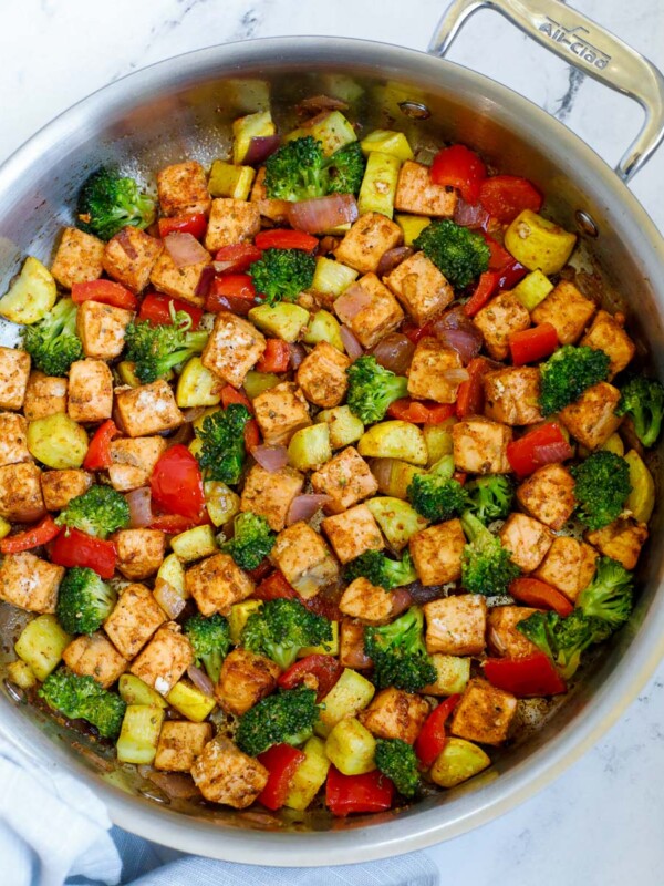 salmon with vegetables served in a skillet