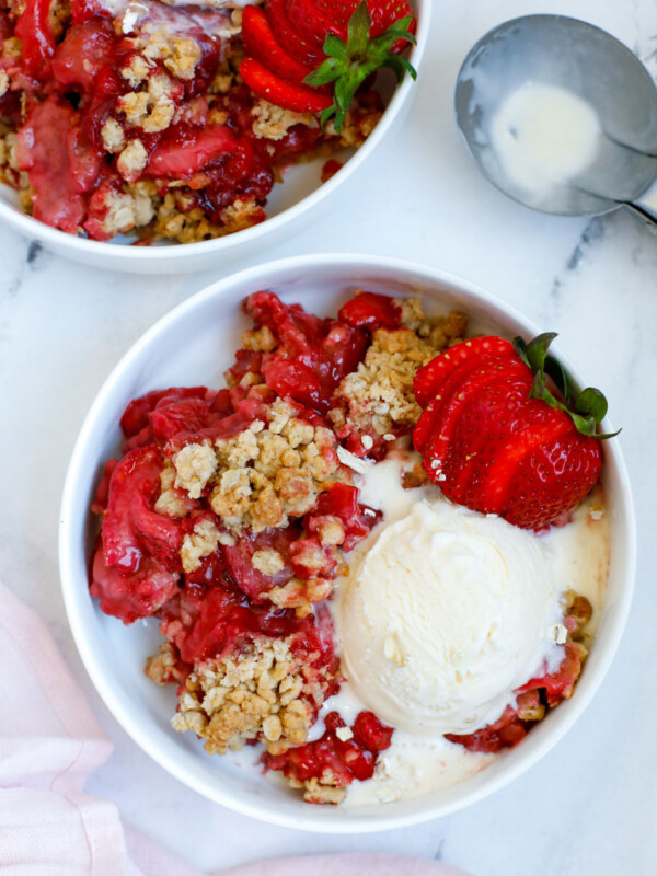 Strawberry Crisp served in a bowl with a scoop of ice cream