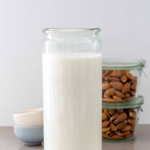 almost milk in a jar with whole almonds in the background