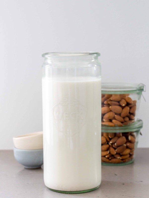 almost milk in a jar with whole almonds in the background