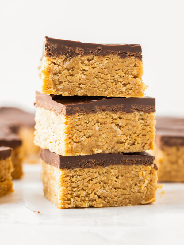 3 chocolate peanut butter oatmeal bars stacked on top of each other.