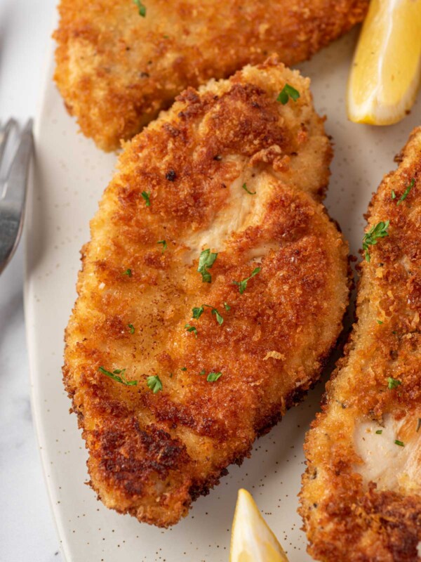 Close up of a crispy parmesan crusted chicken breast.