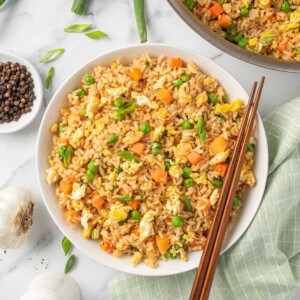 A bowl of the best Chinese fried rice with chopsticks.