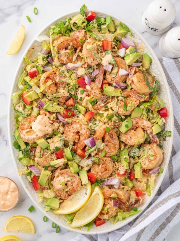 Shrimp salad with lettuce and avocado on a platter.