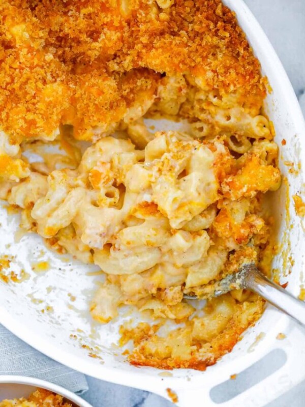 baked mac and cheese with a spoon in the baking dish