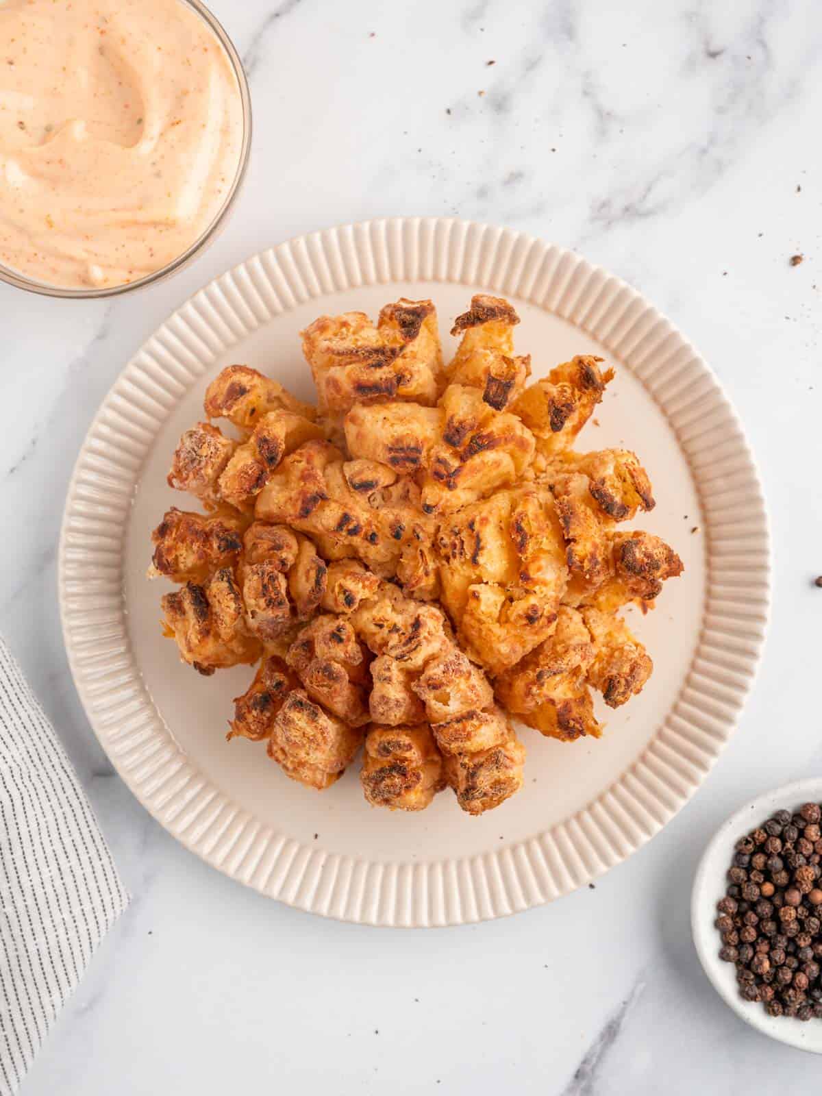 https://www.cookinwithmima.com/wp-content/uploads/2022/12/blooming-onion-air-fryer.jpg
