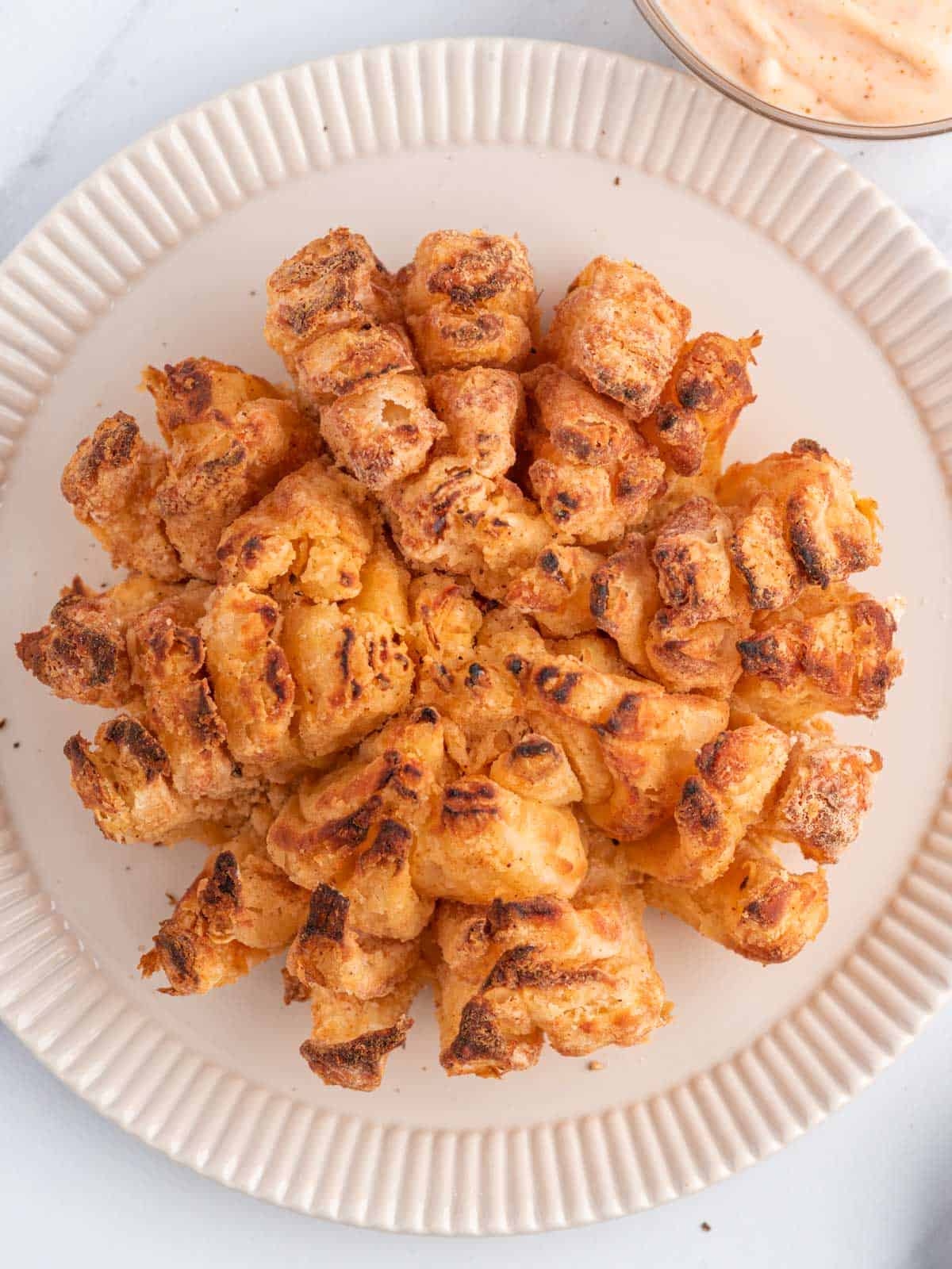 https://www.cookinwithmima.com/wp-content/uploads/2022/12/homemade-bloomin-onion.jpg