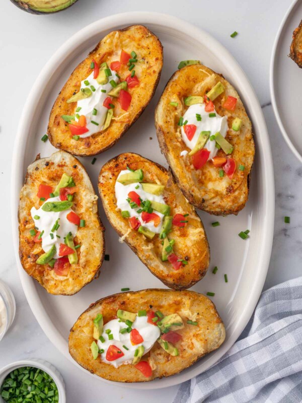 A plate of cheesy air fryer potato skins.