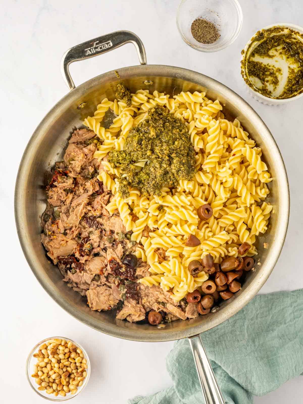 Tuna and noodles are combined with pesto sauce.