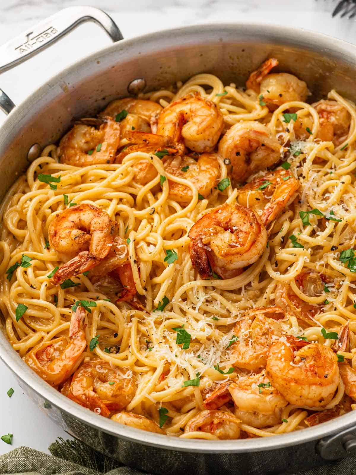 Cajun scampi with shrimp in a skillet.