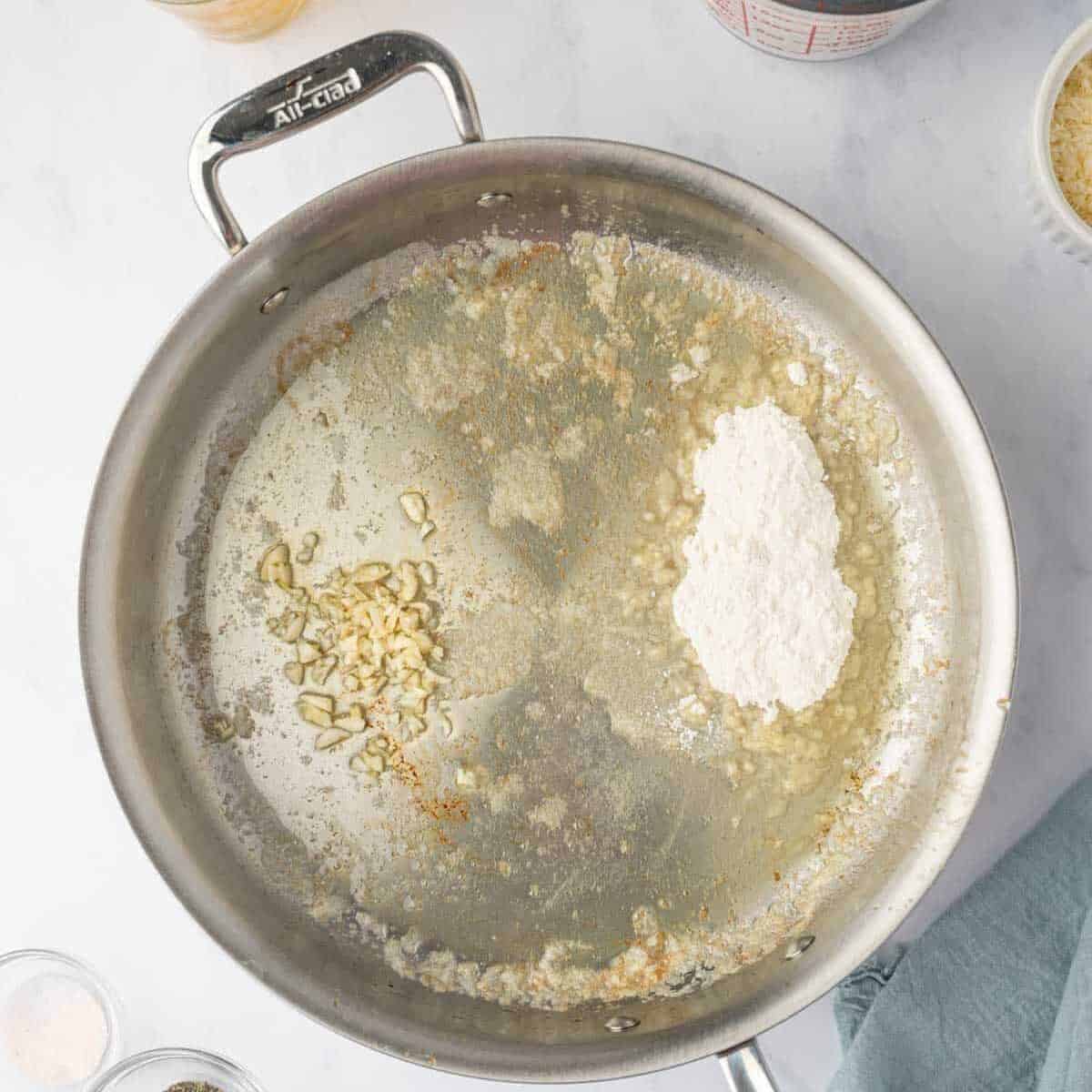 Garlic, flour and butter are combined in a skillet.