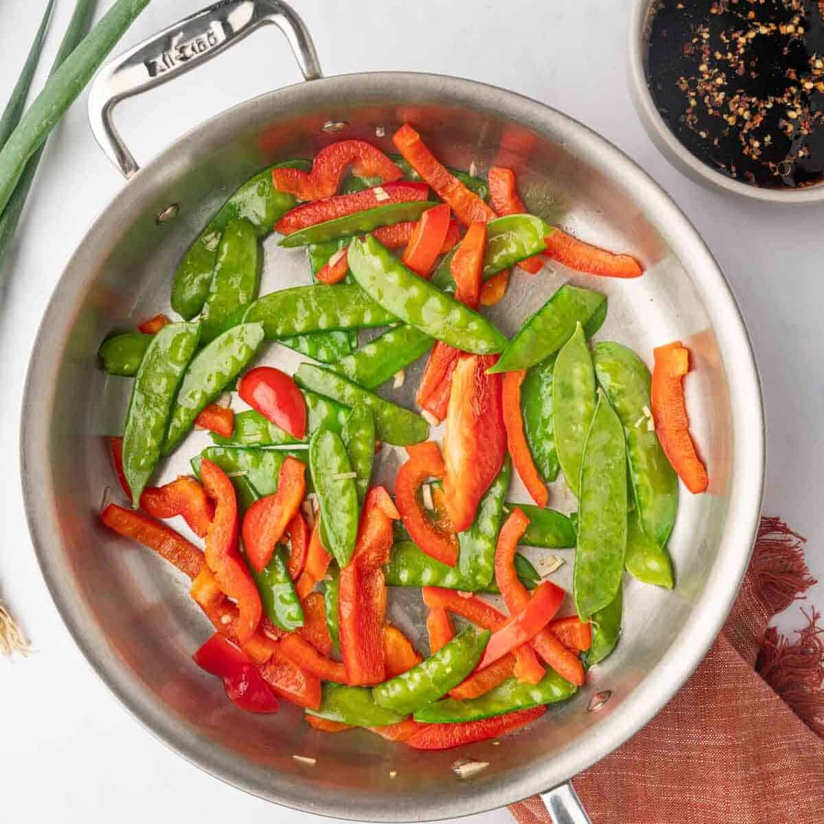 Sauteed vegetables in a skillet.