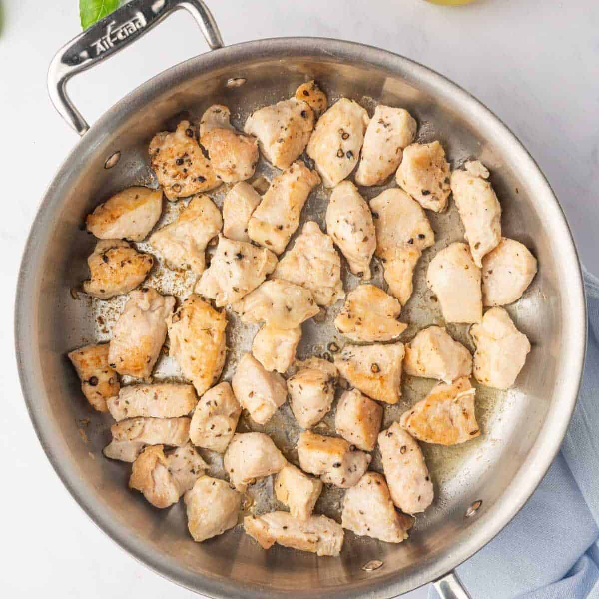 Chicken cooked in a skillet.