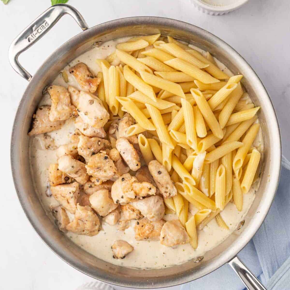 Combine chicken with pasta and sauce.