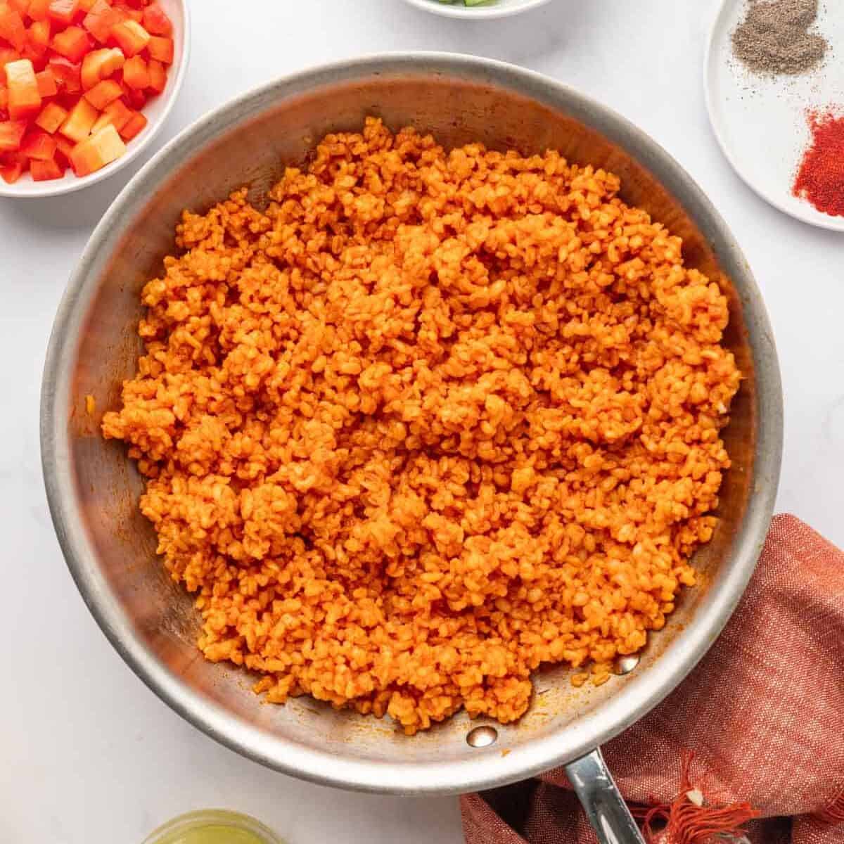Cooked bulgur mixed with the tomato sauce.