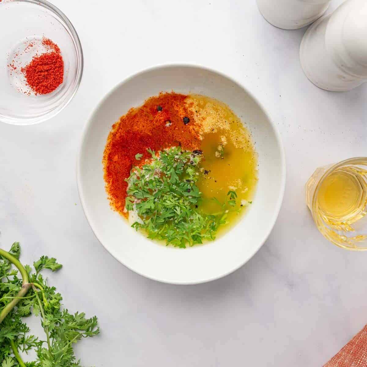 Chicken marinade mixture in a bowl.