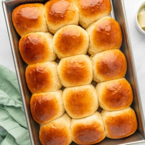 Top down shot of baked hawaiian sweet rolls.