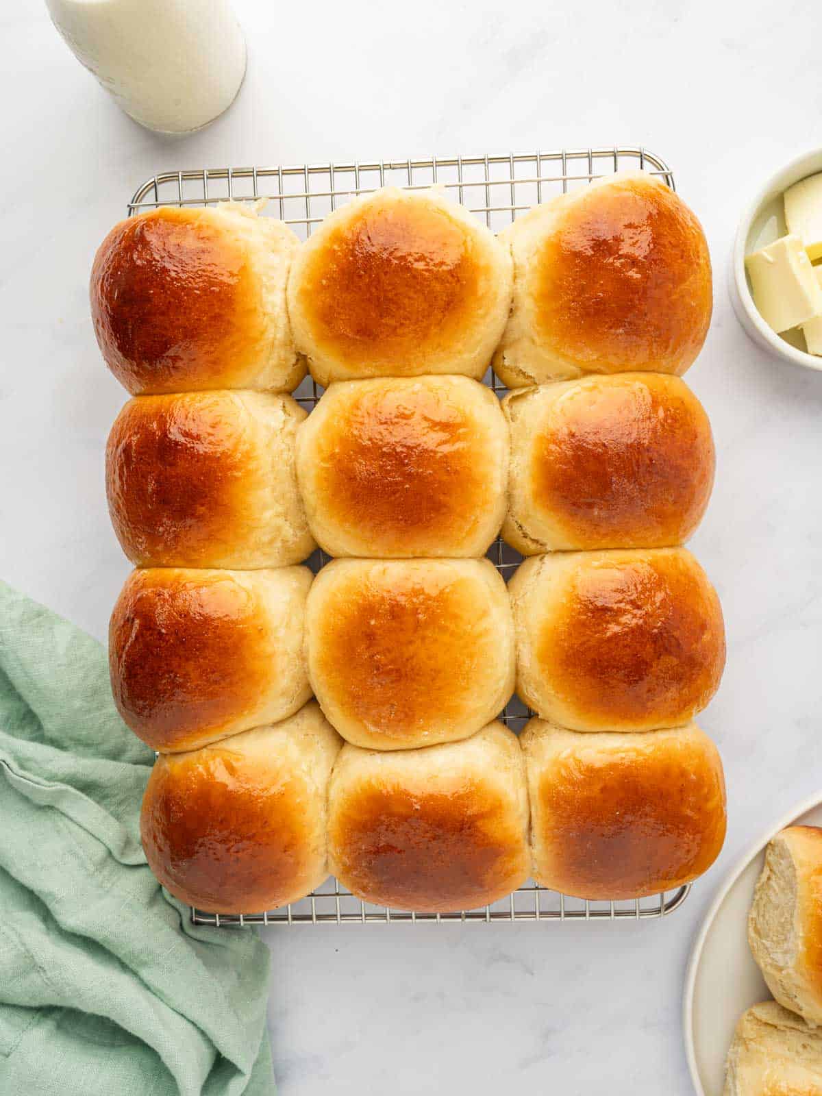 Top down shot of baked hawaiian sweet rolls.